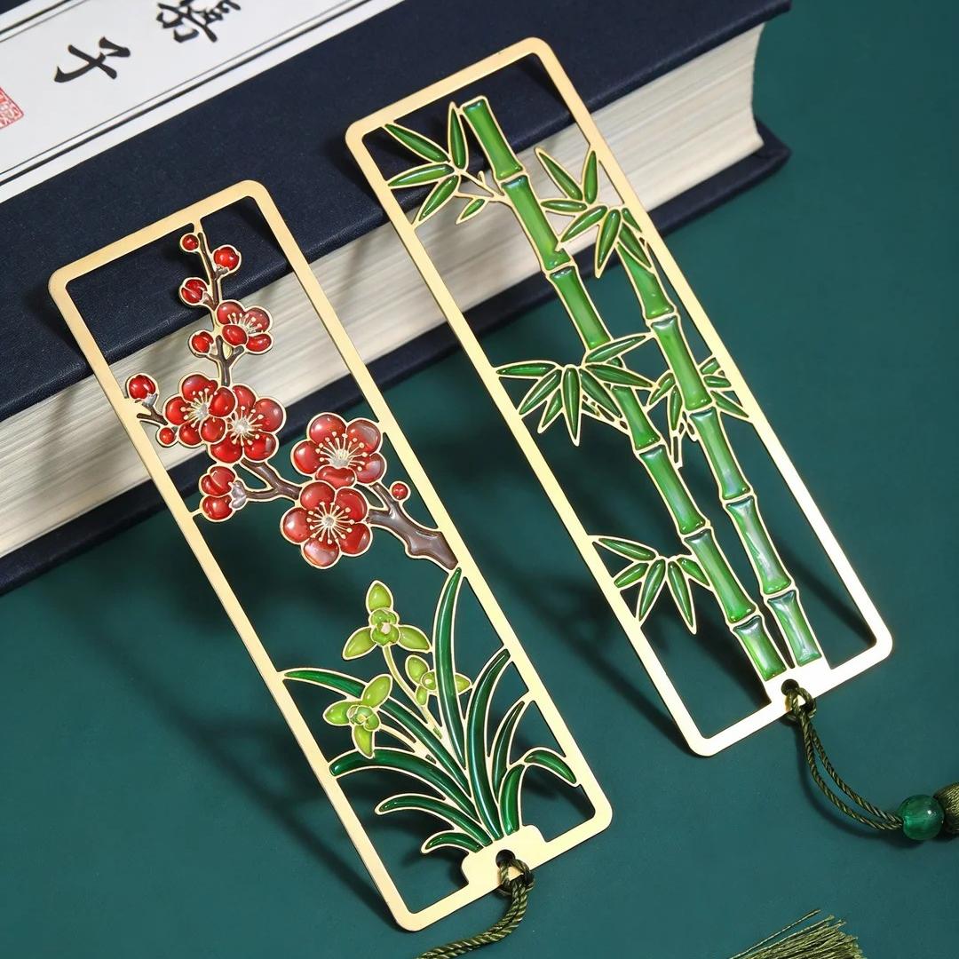 Plum, orchid, bamboo, and chrysanthemum — the four noble plants — hollowed-out alloy bookmark