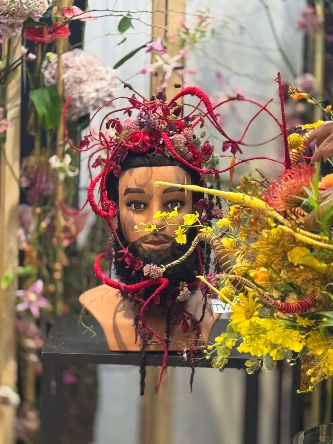 Chinese competitor creating a floristry piece on the competition floor